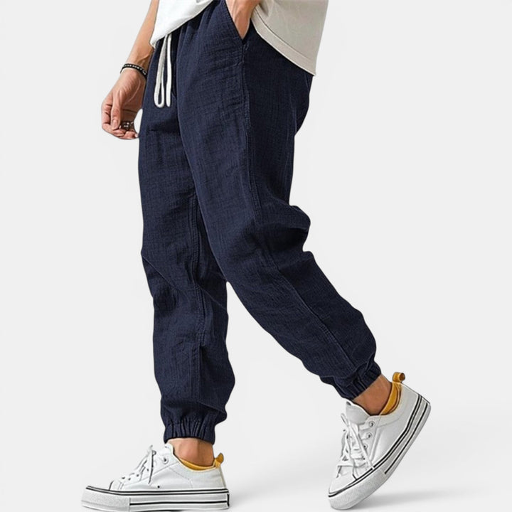 Premium men's breathable pants, designed with a drawstring for a relaxed, tapered fit.