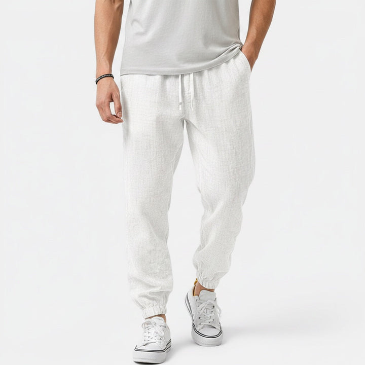 Relaxed fit men's drawstring pants, offering ultimate comfort and a breathable feel.