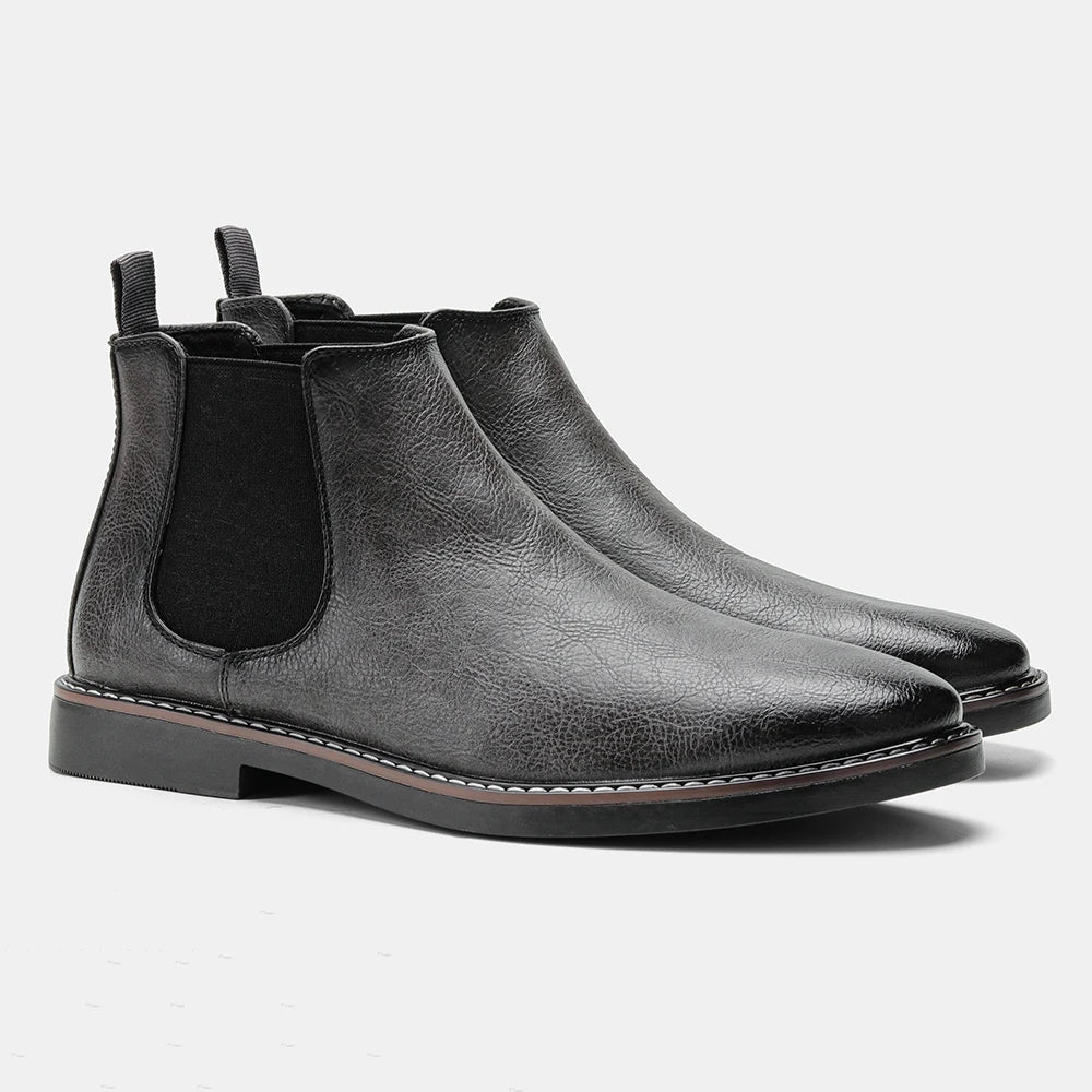 Man walking in comfortable grey suede men's ankle boots, showcasing stylish everyday footwear.