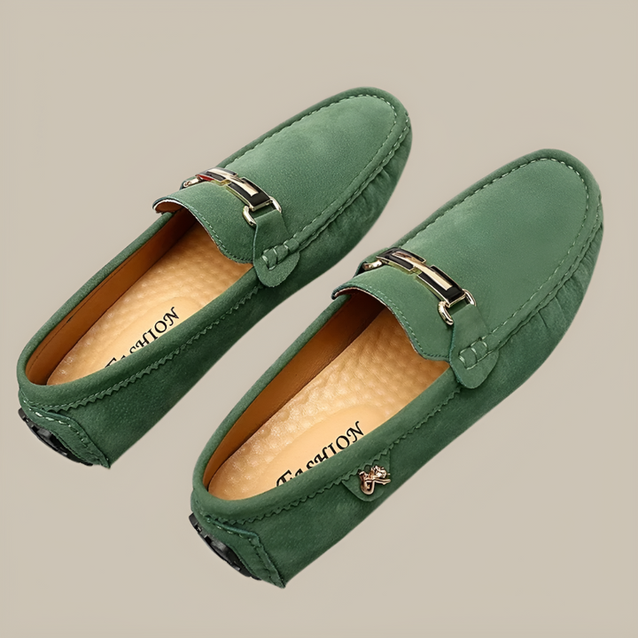 Close-up of men's navy suede slip-on moccasins, showing non-slip soft sole and comfortable design.