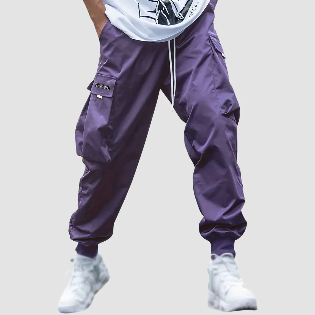 Utility cargo pants for men, featuring multiple functional pockets and a comfortable elastic waist design.