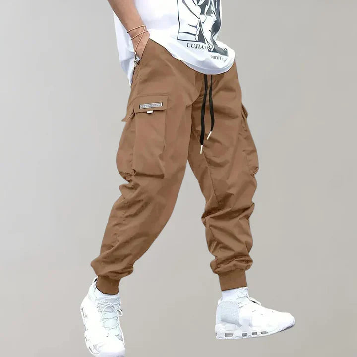 Stylish men's tapered fit cargo pants. Modern design with utility pockets, perfect for contemporary fashion.