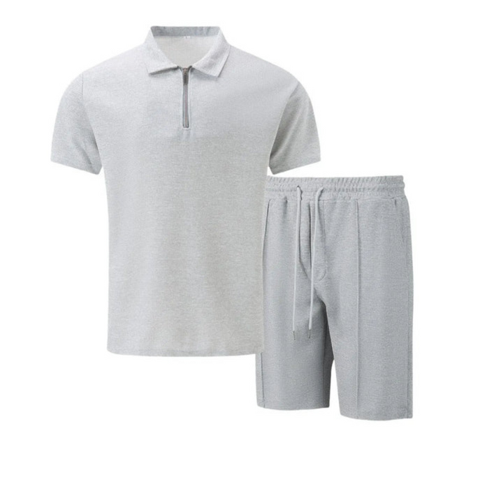 Fashionable men's casual co-ord set: zip polo shirt & drawstring shorts. Essential summer outfit.