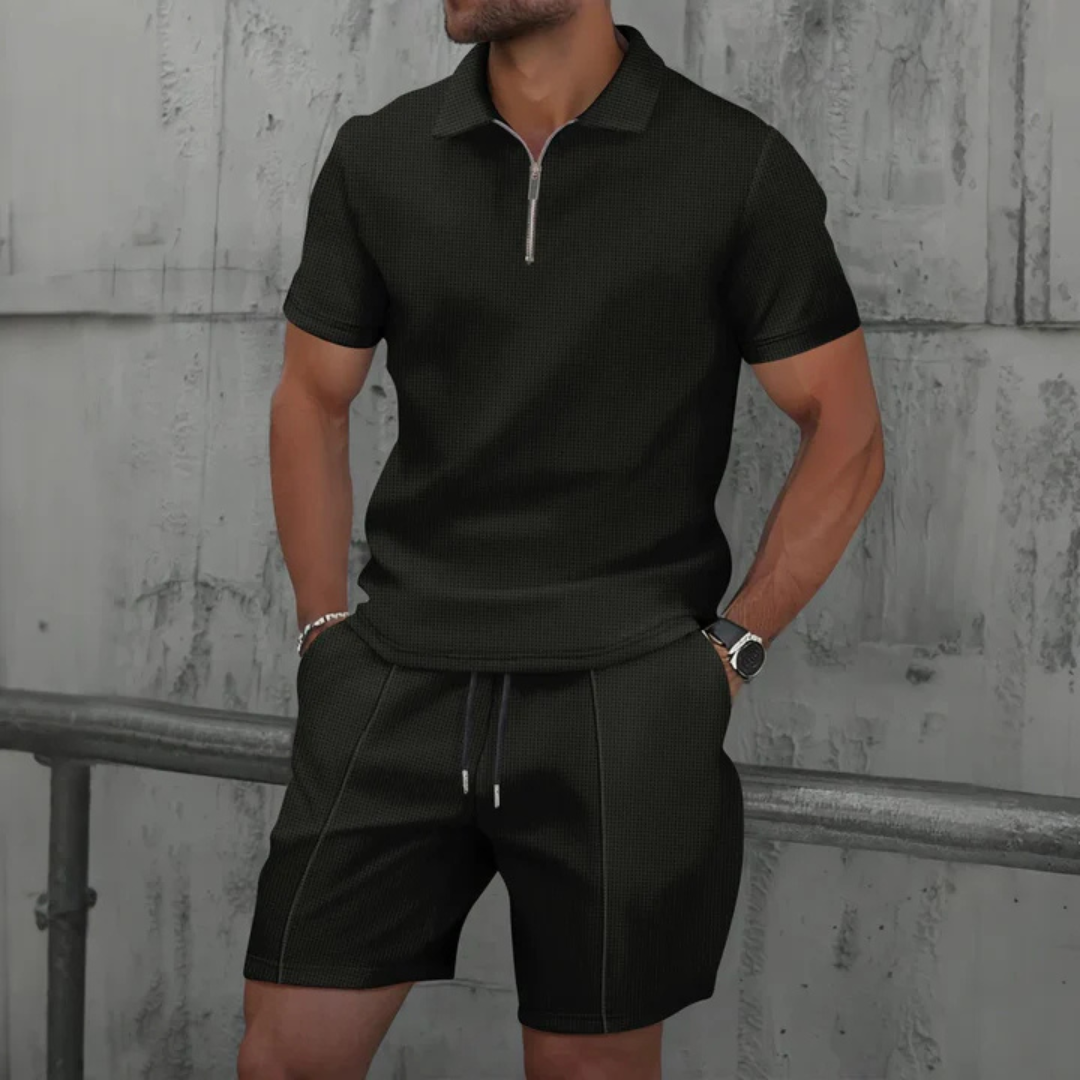 Casual men's outfit: two-piece polo and drawstring shorts set. Perfect for summer, travel, & relaxed fashion.