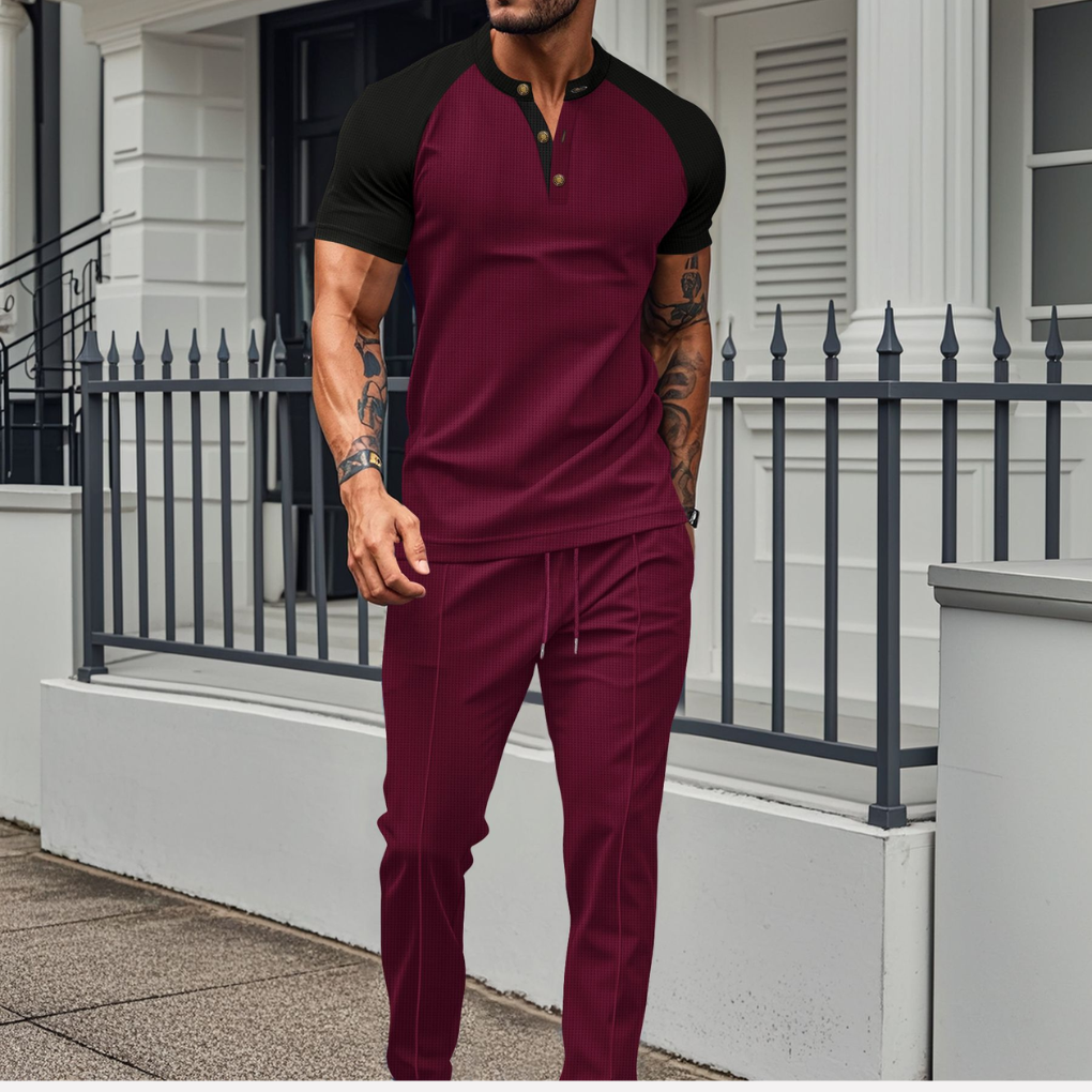 Men's stylish contrast Henley shirt & jogger set. Comfortable two-piece casual outfit for lounging or athletic wear.