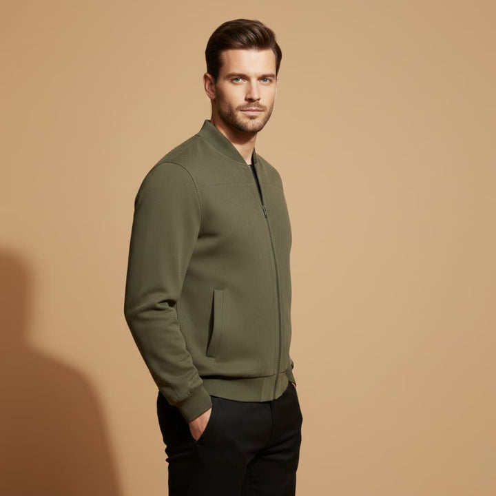 Man wearing a casual men's everyday bomber jacket. Stylish, versatile outerwear for spring and fall activities.