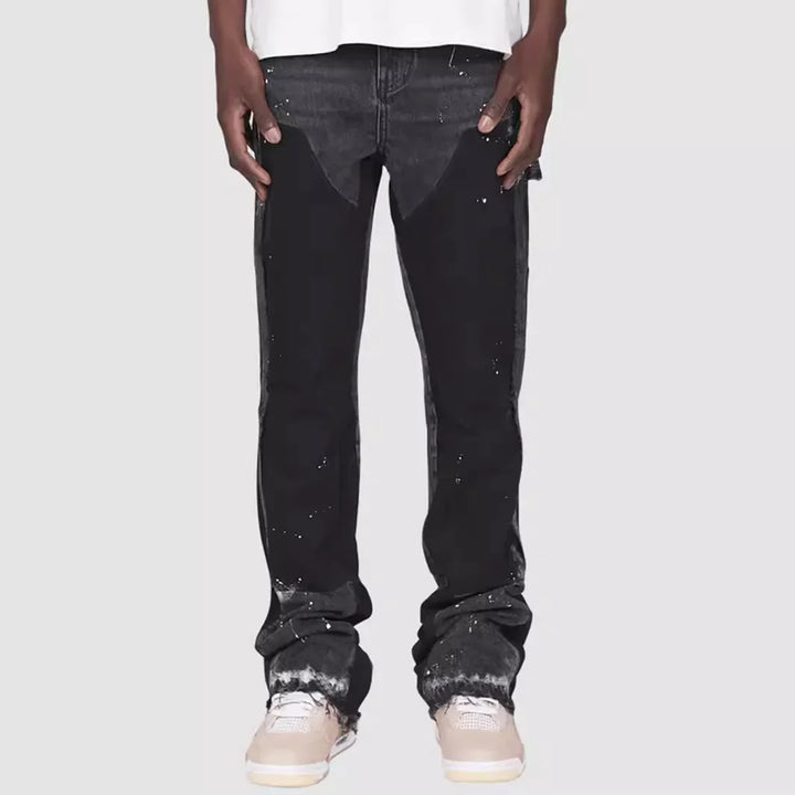 Men's stylish flared jeans with a unique layered look design, perfect for modern street style fashion.