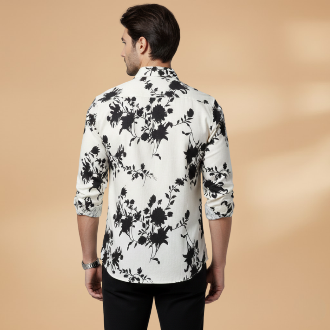 Detail shot of the buttons and collar on a mens patterned casual long sleeve shirt.