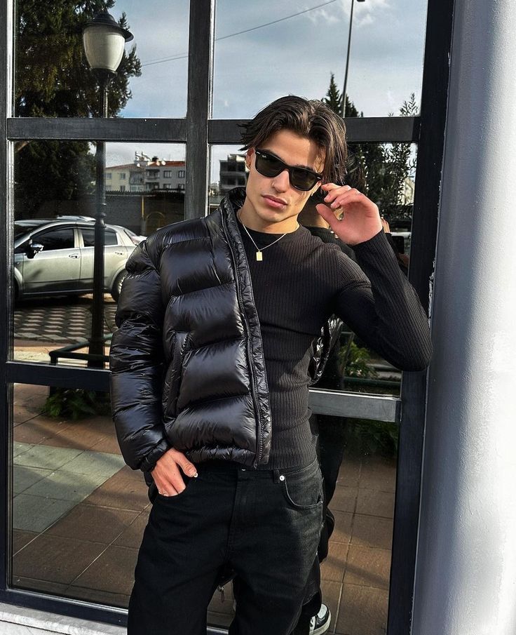 Model wearing a casual men's fashion puffer jacket, perfect outerwear for urban cold weather style.