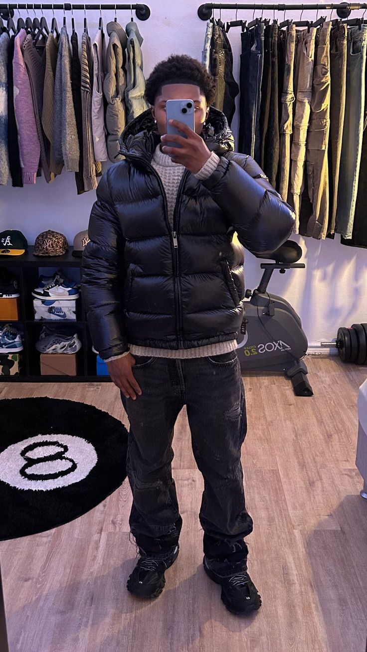 Back view of a sleek men's winter coat, showing the tailored fit of this warm, insulated puffer jacket.