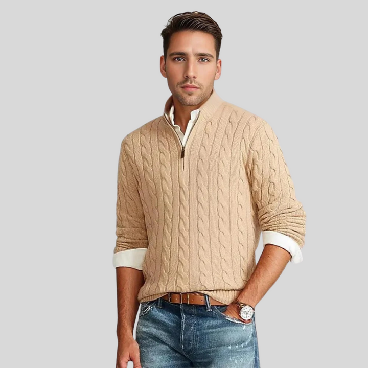 Close-up of men's grey cable knit quarter-zip pullover sweater, showcasing intricate texture and comfortable fit.