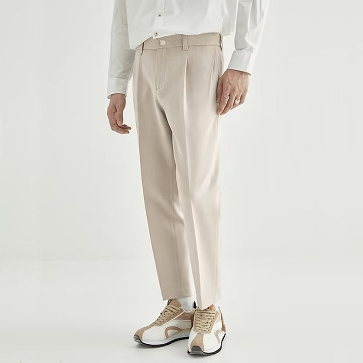 Back view of men's stylish high-waisted pleated straight leg cropped dress trousers, comfortable fit.