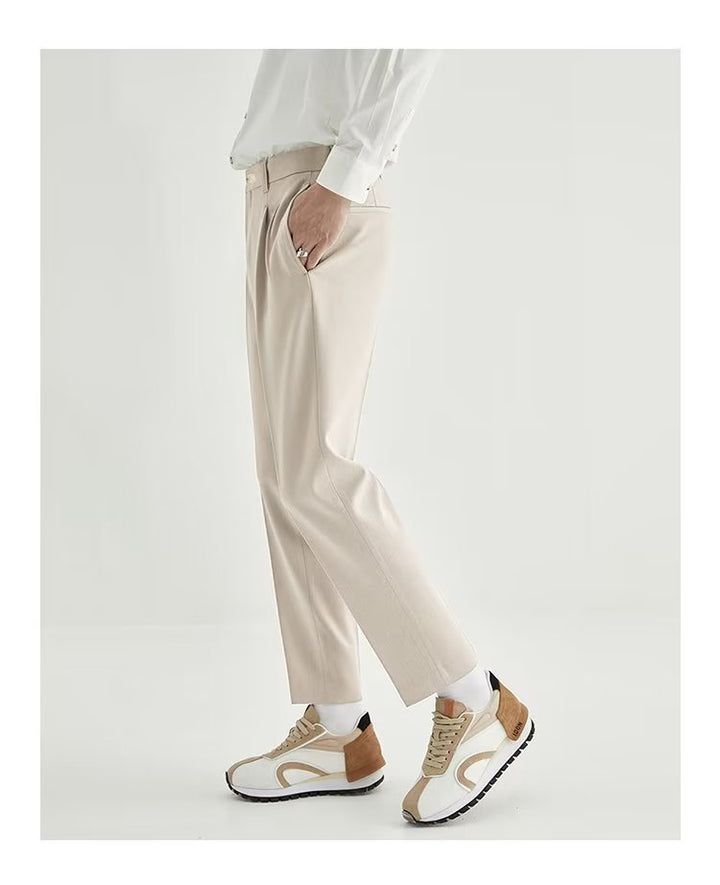 Side view of men's modern high-waisted pleated straight leg cropped pants, ideal for casual wear.