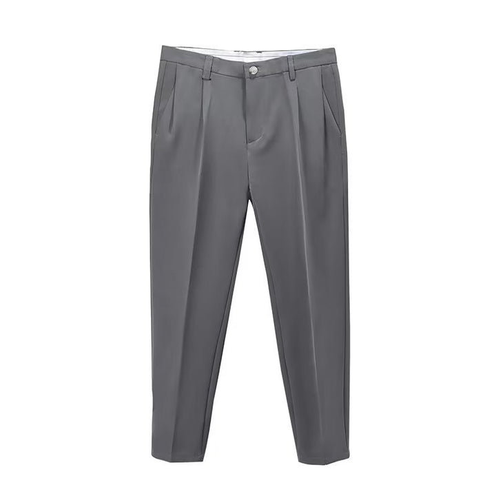 Men's stylish high-waisted pleated cropped pants in motion, demonstrating the comfortable straight-leg fit.