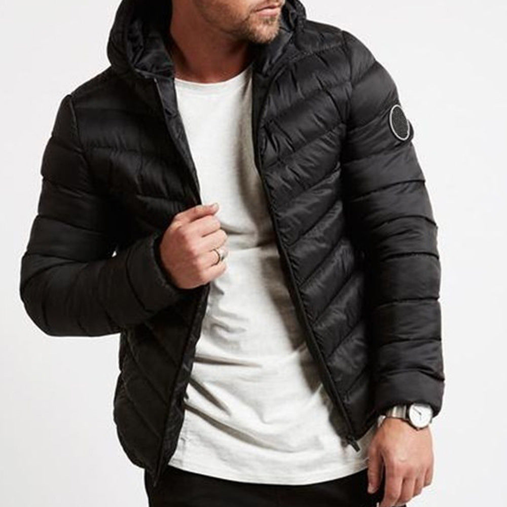 Stylish men's full-zip hooded puffer jacket. Warm, insulated, quilted winter outerwear, great for cold weather fashion.