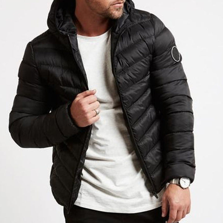 Stylish men's full-zip hooded puffer jacket. Warm, insulated, quilted winter outerwear, great for cold weather fashion.