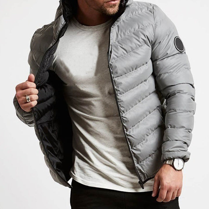 Men's warm hooded puffer jacket. Stylish, full-zip, insulated winter coat with quilted design for cold weather comfort.