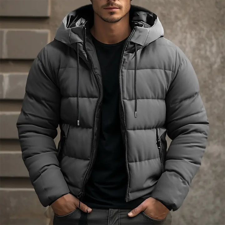 Durable men's hooded puffer jacket. Insulated winter outerwear offers ultimate warmth & protection from the cold.