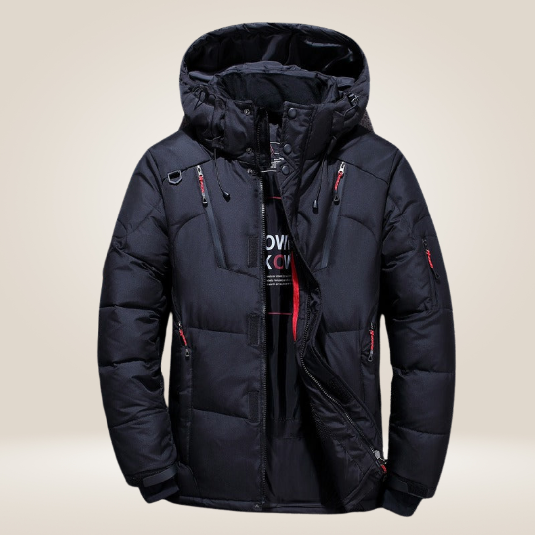 Man modeling a warm, weatherproof men's winter coat, ideal for stylish outdoor cold weather fashion.