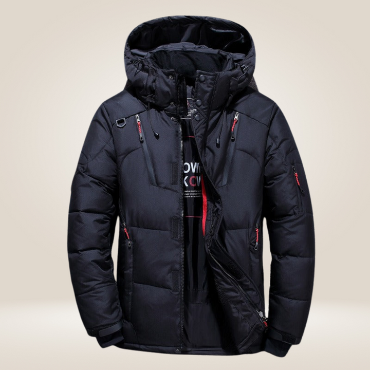 Man modeling a warm, weatherproof men's winter coat, ideal for stylish outdoor cold weather fashion.