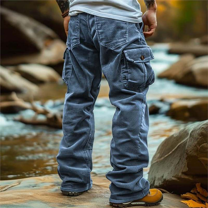 Functional men's cargo utility pants with multiple large pockets for outdoor activities & travel convenience.