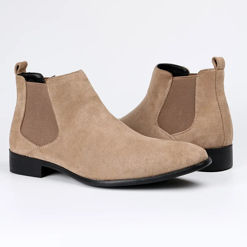 Classic black men's pull-on Chelsea boots with elastic sides for easy wear, a modern footwear choice.