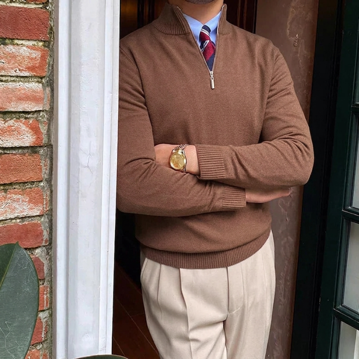 Close-up of men's quarter-zip mock neck sweater fabric. Shows texture, perfect for stylish fall/winter comfort.
