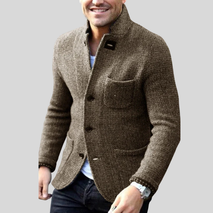 Menswear quilted jacket with a modern design, offering warmth & style for winter fashion. Button-front blazer.