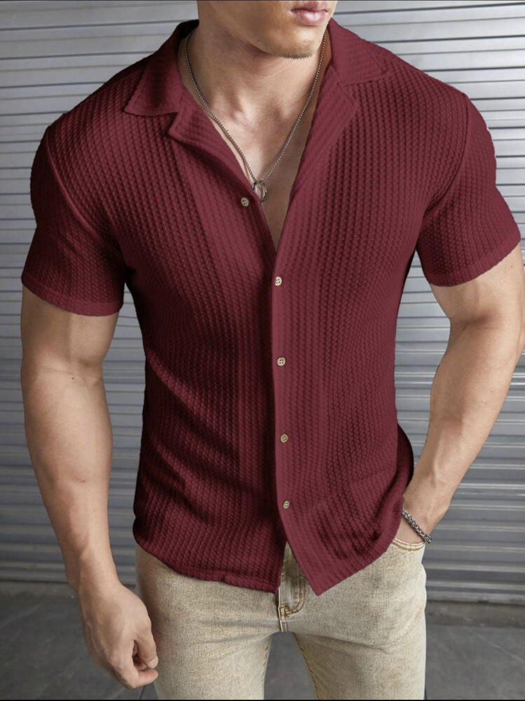Men's stylish ribbed knit button-front shirt with short sleeves and spread collar. Ideal for smart casual wear.