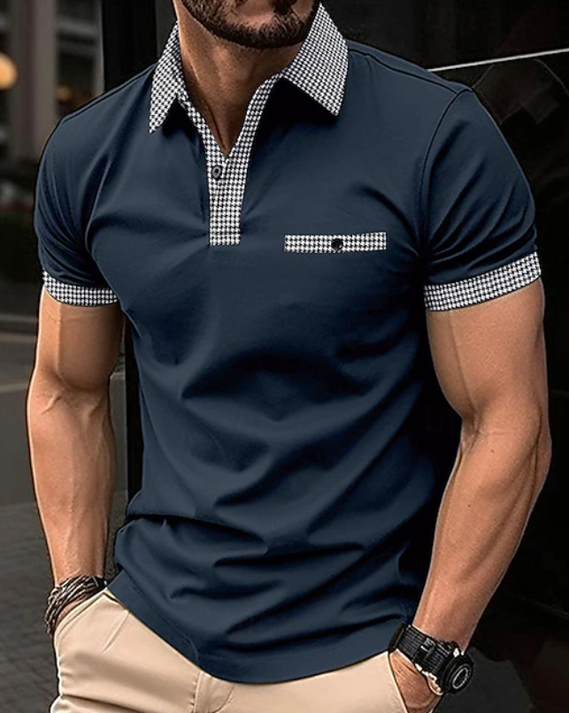 Close-up of a men's polo shirt, highlighting the trendy checkered collar, button placket, and soft fabric.