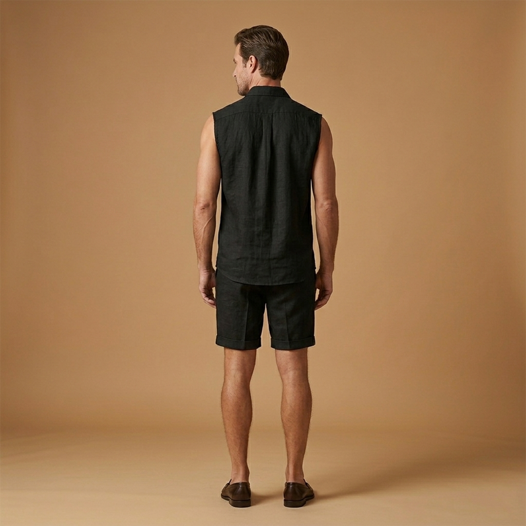 Men's summer vacation outfit: relaxed fit sleeveless button shirt & matching shorts for beach style.