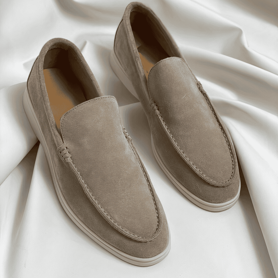 Classic men's dress loafers with a slip-on design, ideal for formal office wear or elegant casual styling.