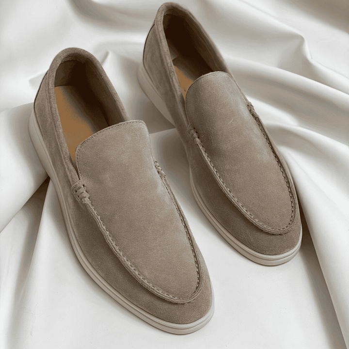 Classic men's dress loafers with a slip-on design, ideal for formal office wear or elegant casual styling.