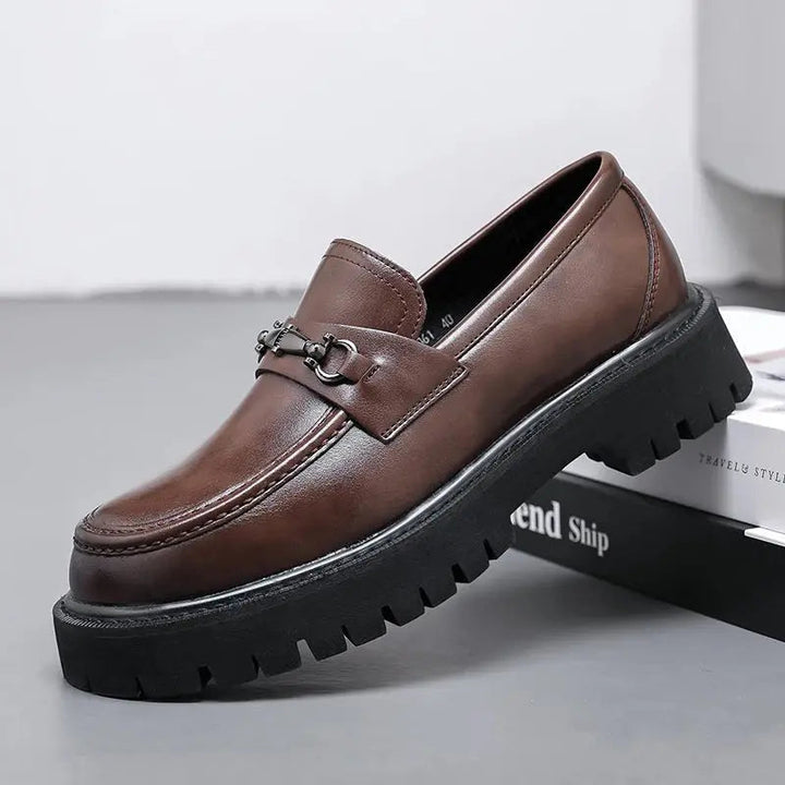 Men's stylish slip-on loafers with metal buckle, perfect for smart casual and business attire.