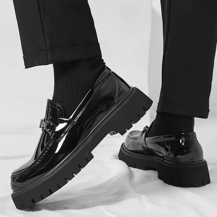 Versatile men's slip-on loafers, buckle detail, suitable for both formal and smart casual ensembles.