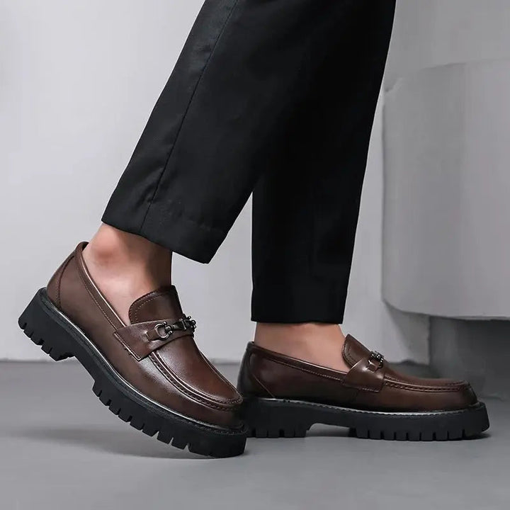 Formal men's dress loafers with sleek metal buckle, ideal for business meetings and events.