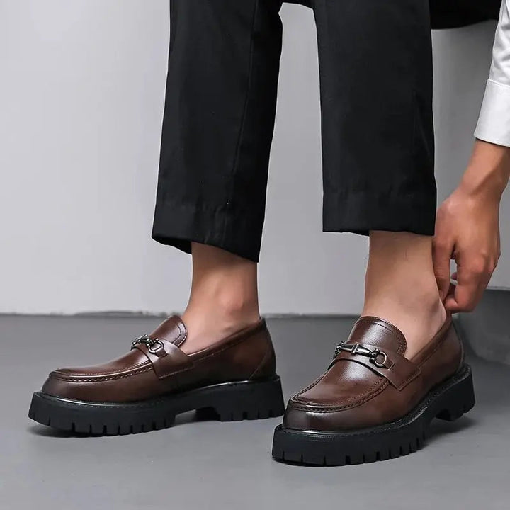 Classic men's buckle loafers, slip-on design for sophisticated business or smart casual outfits.