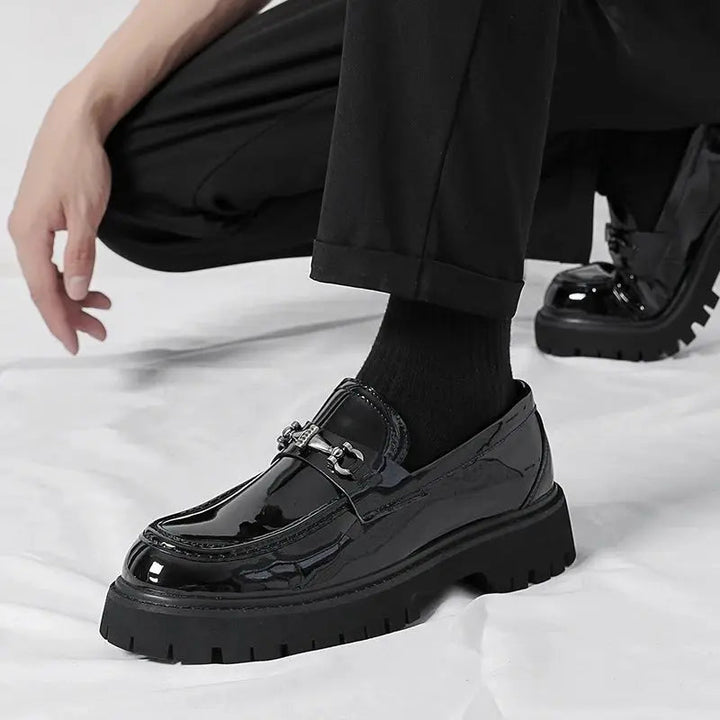 Elevate men's style with sophisticated slip-on buckle loafers, ideal for dress or casual looks.