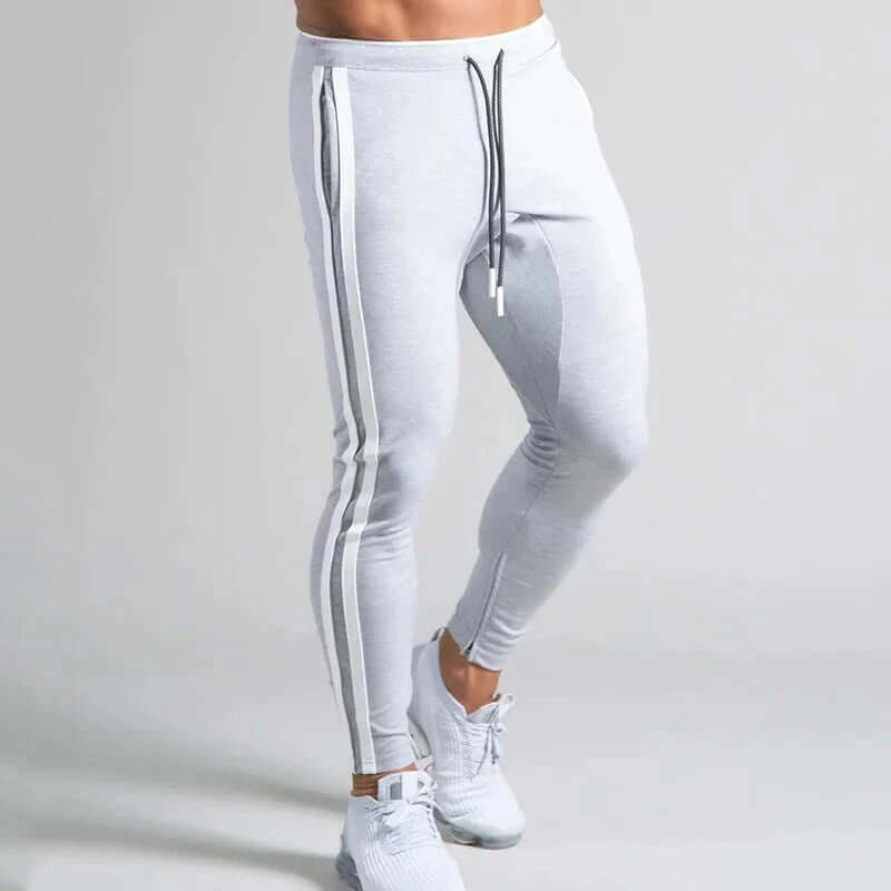 Lay-flat view of men's striped skinny casual pants, emphasizing comfortable & stylish design.