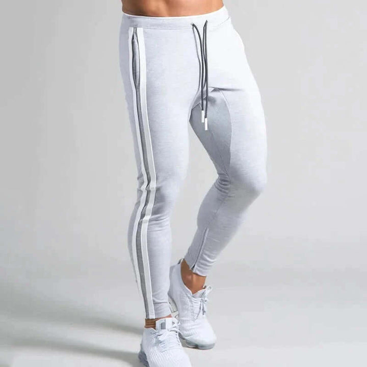 Lay-flat view of men's striped skinny casual pants, emphasizing comfortable & stylish design.
