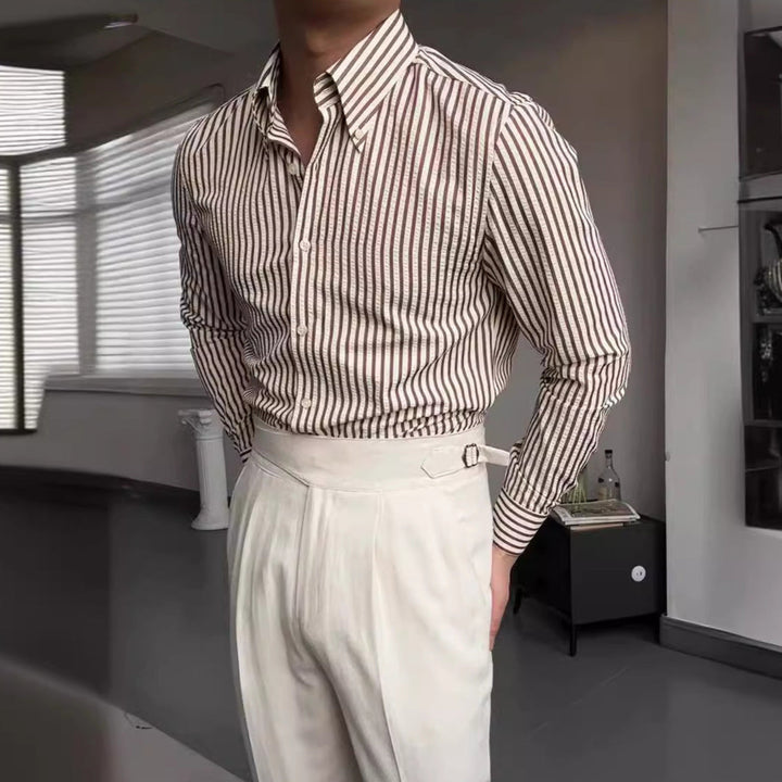 Men's stylish striped button-down shirt, perfect for casual or formal occasions, with long sleeves and regular fit.