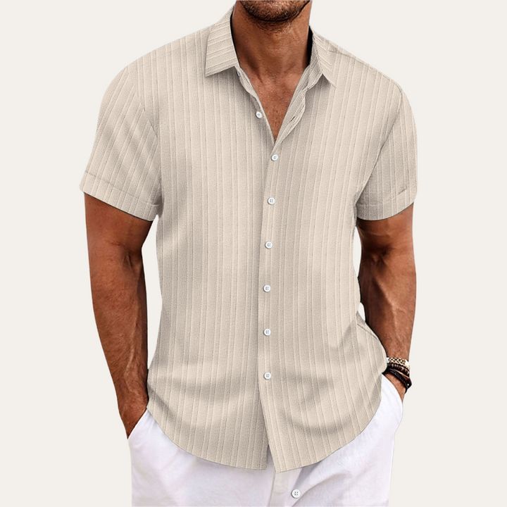 Versatile men's striped short-sleeve button-down shirt, great for office casual or summer wear.