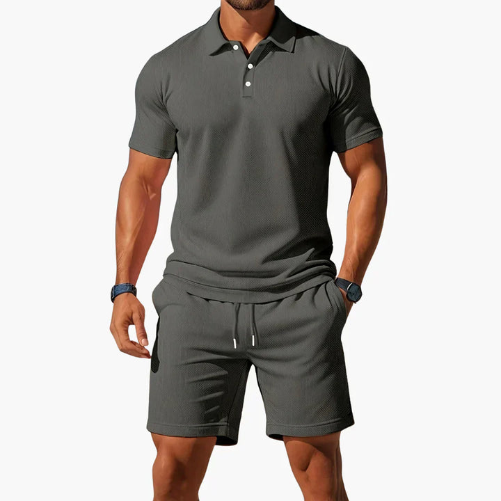 Fashionable men's summer outfit featuring a polo and shorts set, ideal for casual days and warm weather.
