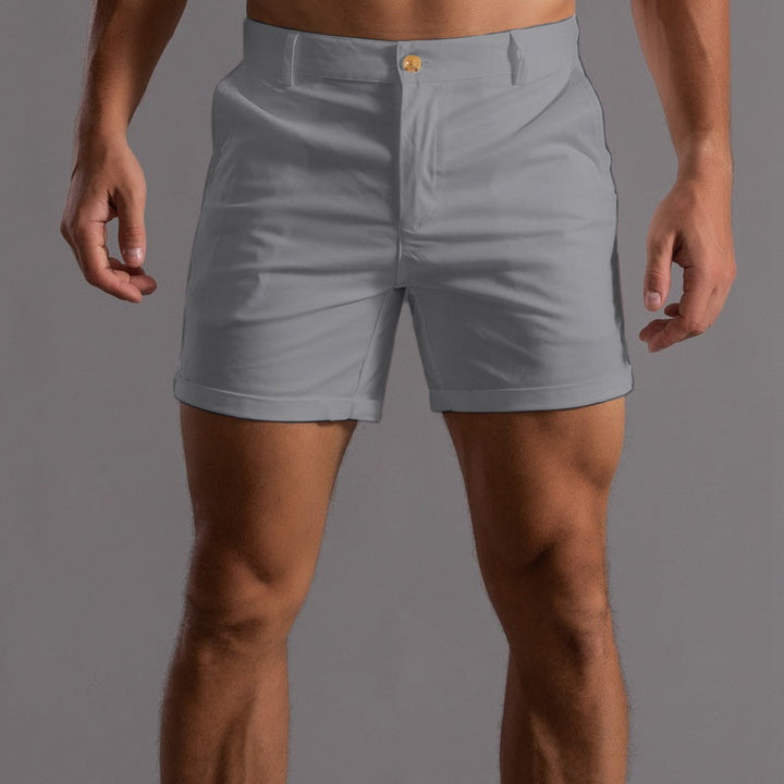 Man wearing stylish tailored chino shorts, perfect for summer casual outings & comfortable everyday wear.