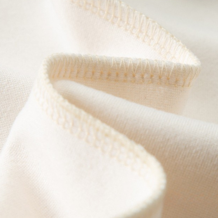 Close-up of men's tracksuit fabric, showing texture of the zip hoodie & joggers, high-quality athletic wear.