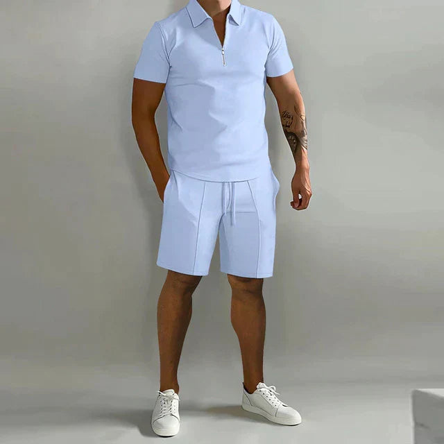 Fashionable men's summer two-piece outfit: comfortable polo shirt & matching shorts for stylish resort wear.