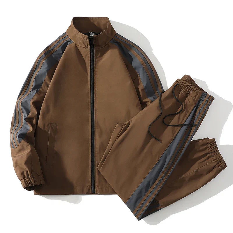 Fashionable men's two-piece tracksuit with full zip jacket and matching joggers.