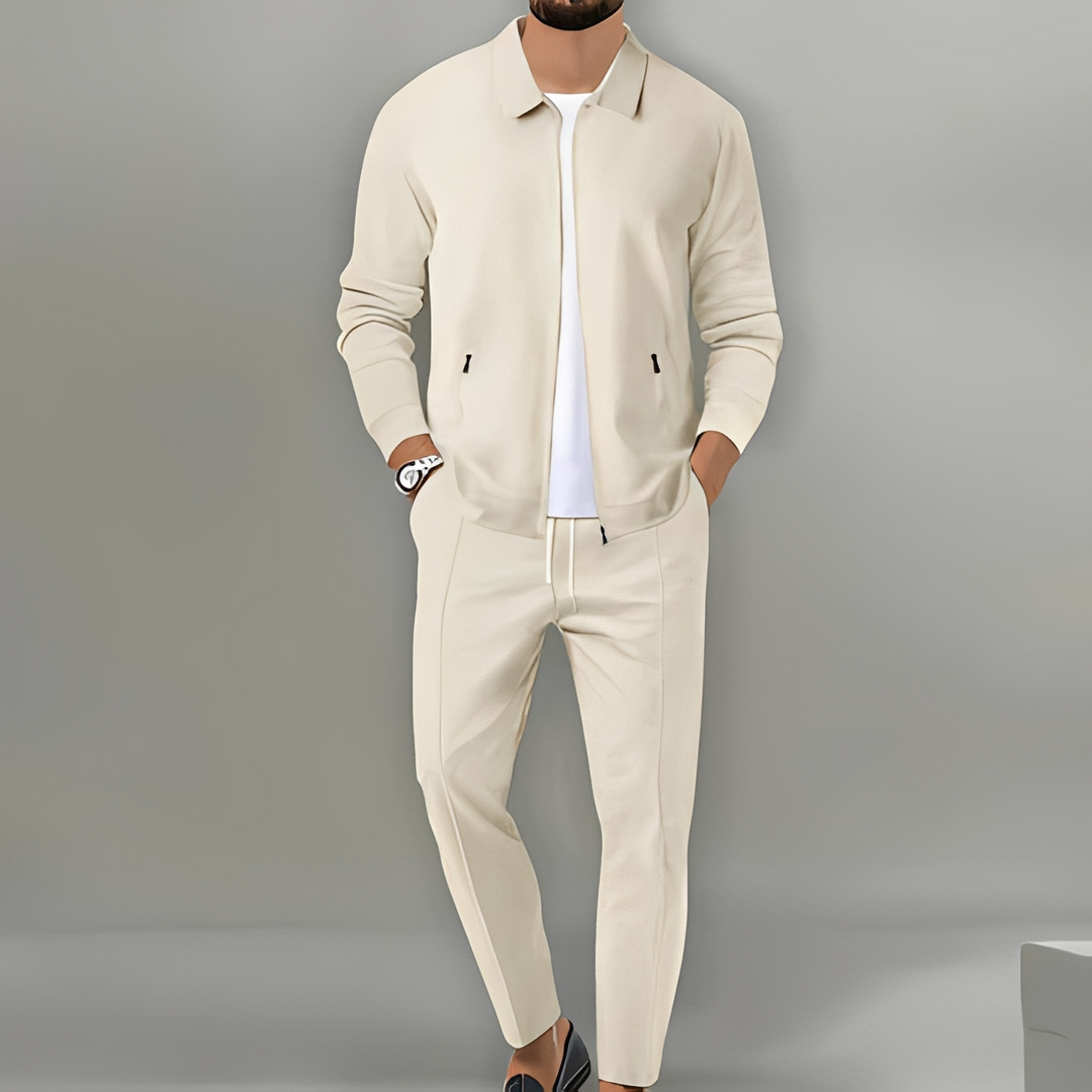 Comfortable men's athletic two-piece zip-up tracksuit with a full-zip jacket and matching pants.