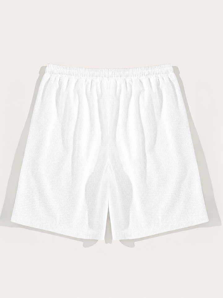 Versatile men's summer drawstring shorts. Textured fabric & breathable design for casual, beach, or everyday wear.