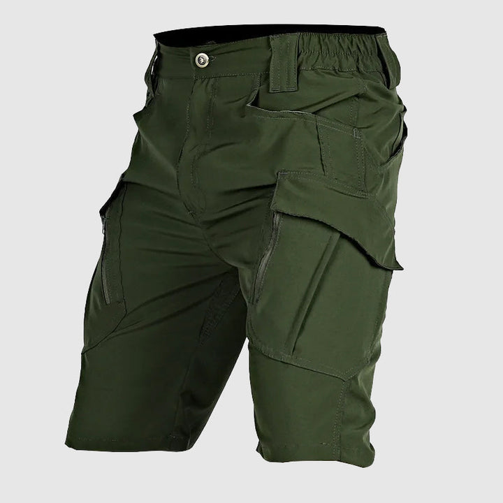Relaxed fit men's cargo shorts, durable utility design with numerous tactical pockets for practicality.